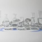 Conceptual photo showing varying glass vessels with different water levels symbolizing individual caffeine responses.